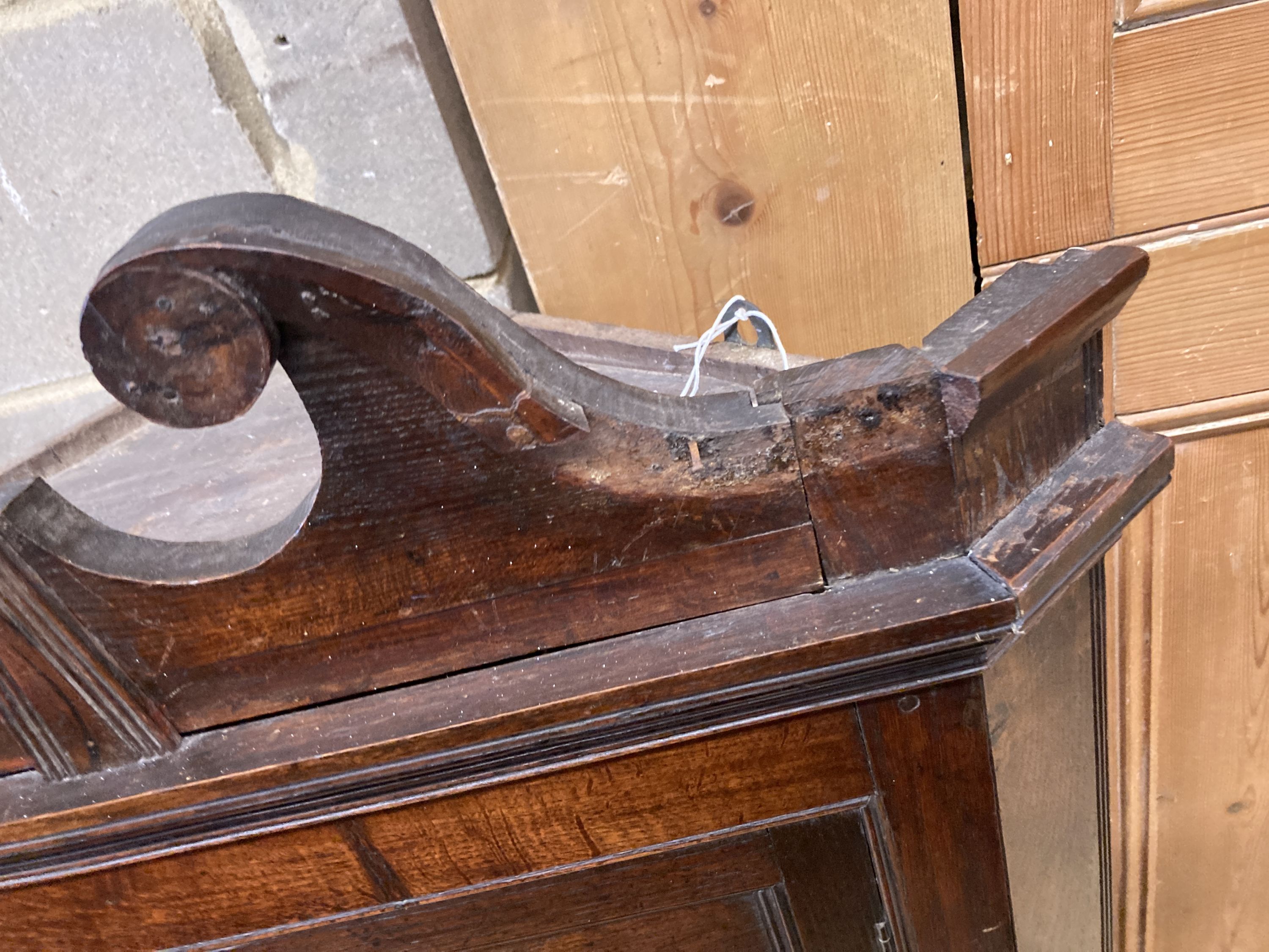 A George III oak hanging corner cabinet, width 72cm, depth 36cm, height 110cm